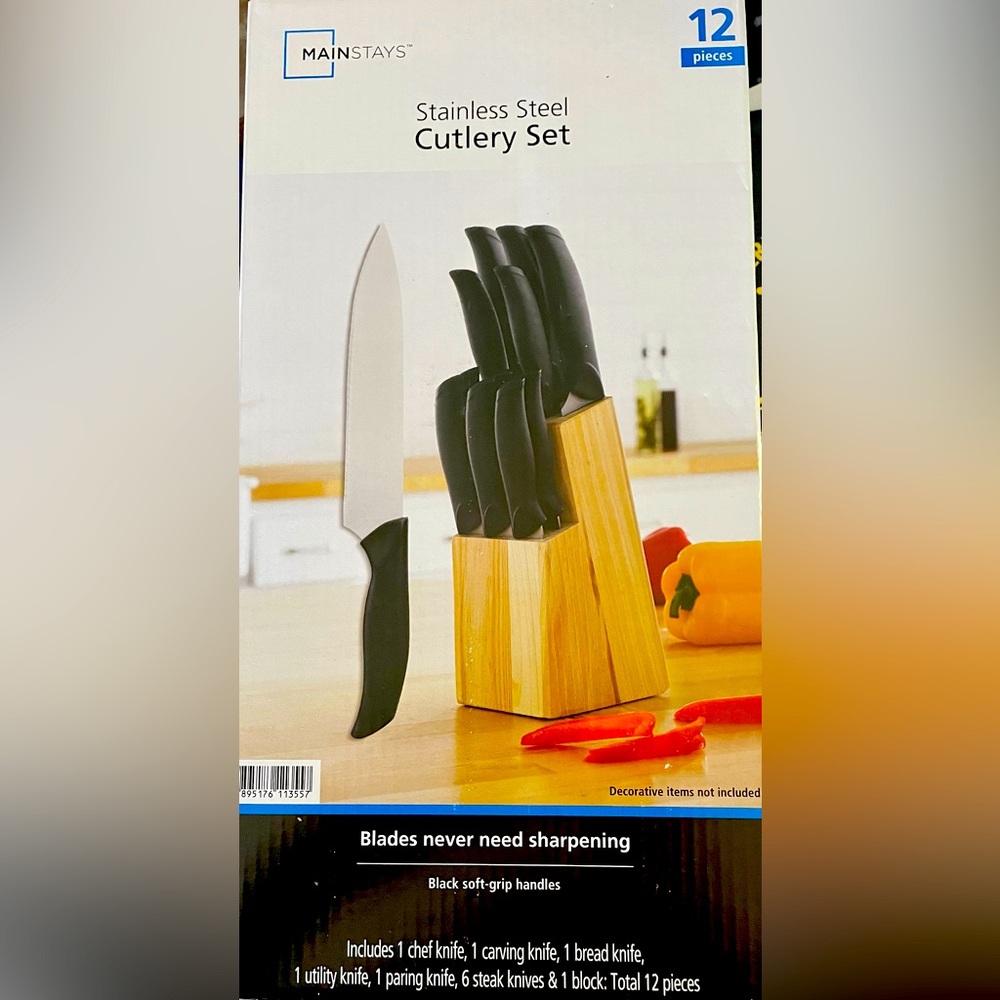 Stainless steal Cutlery set . NWT. Black soft grip handles with wood block .